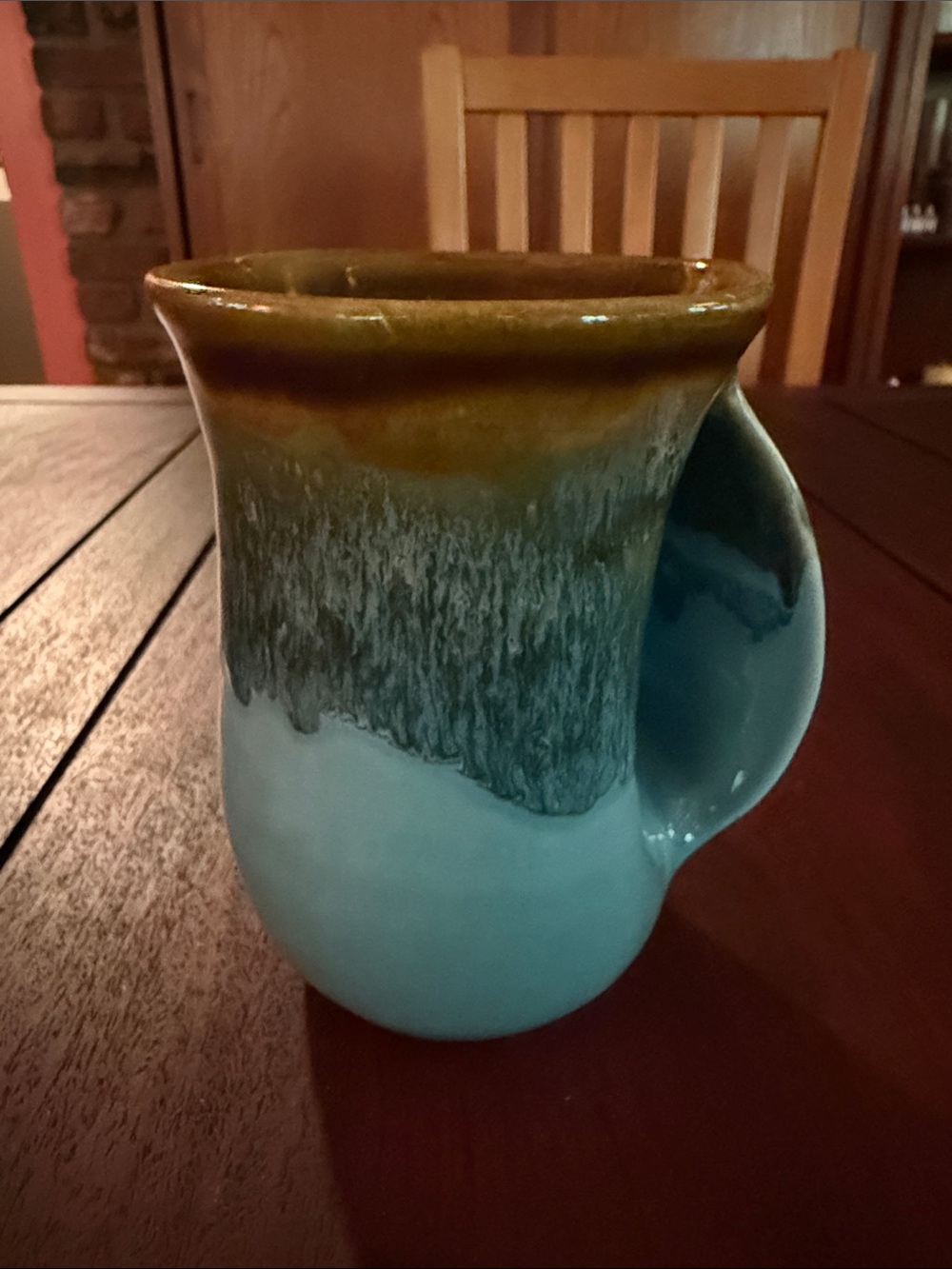 Handcrafted Ceramic Mug with Integrated Handle in Teal and Brown Glaze